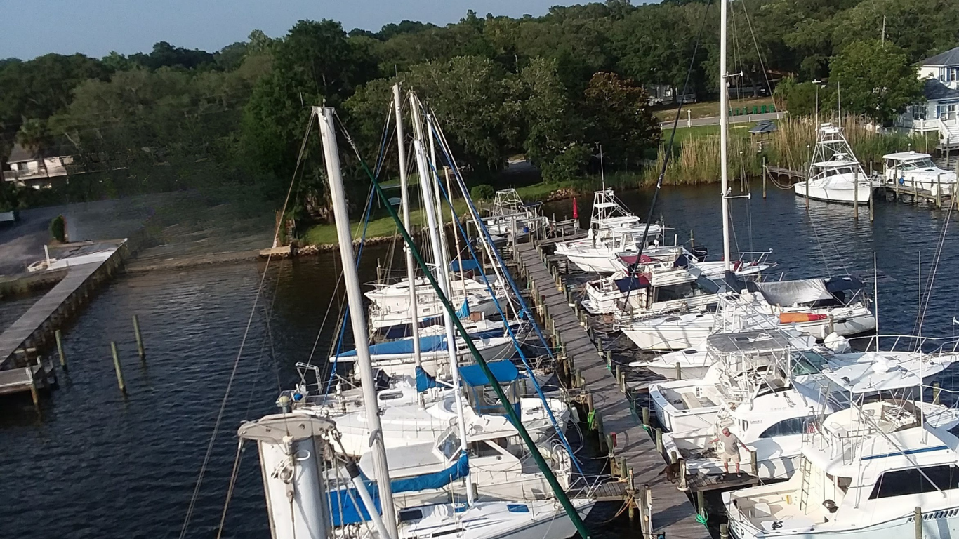 Aerial view of Oak Marina showing the wooden dock and boats on Boggy Bayou in Niceville, Florida